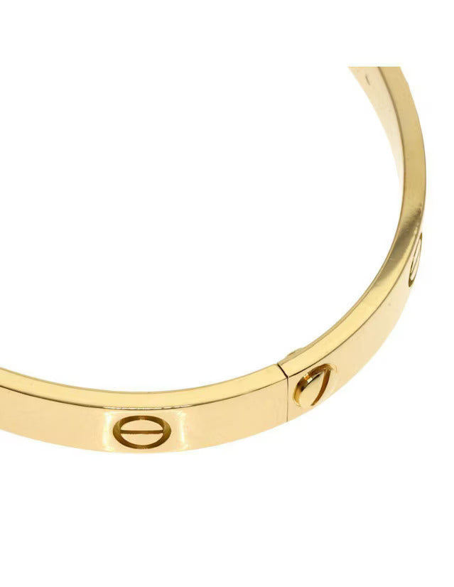 Brazalete con destornillador dorado