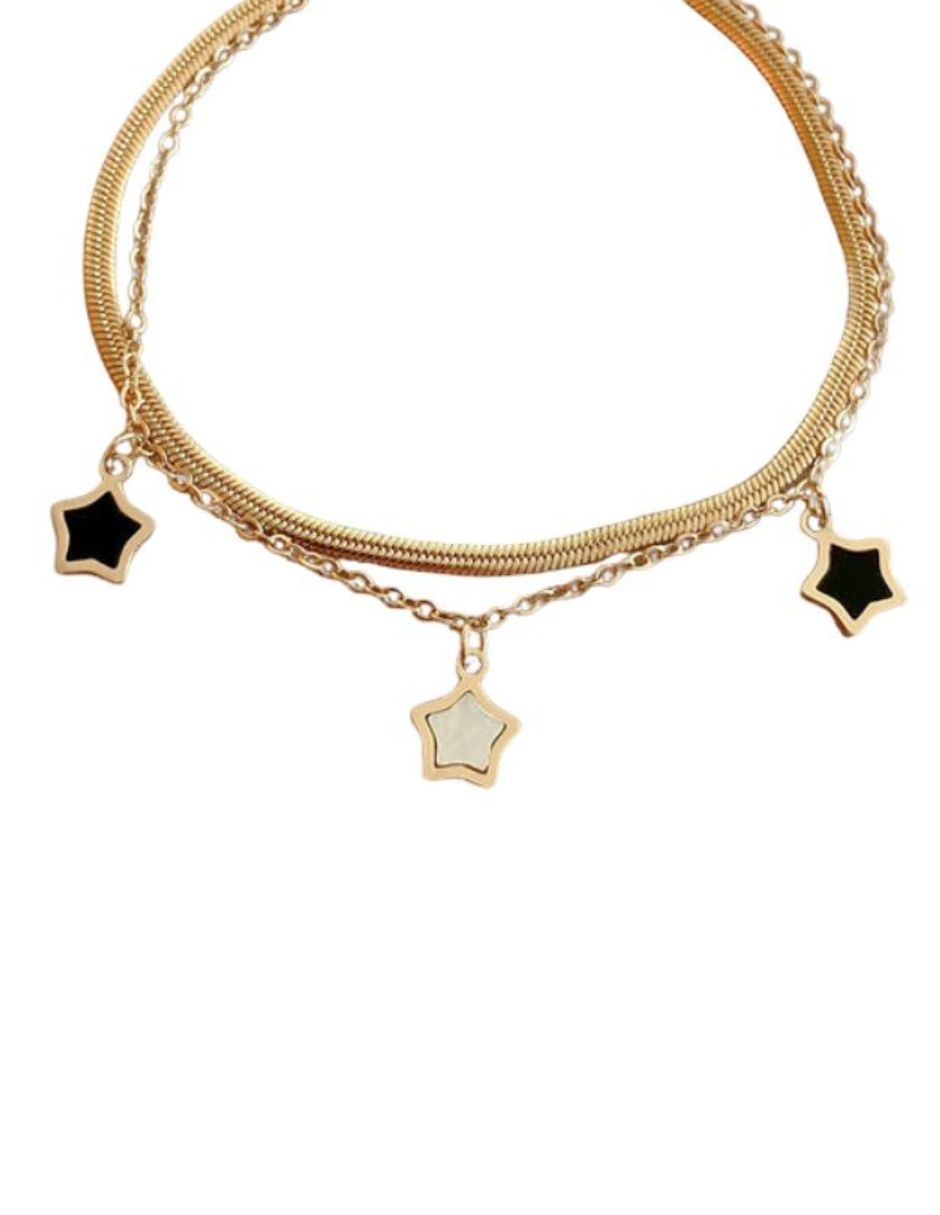 Pulsera de oro laminado con estrellas negras con blanco